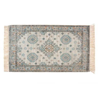 This is a decorative throw rug with fringe on either end. The size is 2' x 4.25'.