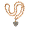 Wooden beads with grey heart.  Large wooden beads, approx. .75" in diameter and 2 feet long with heart at the end.