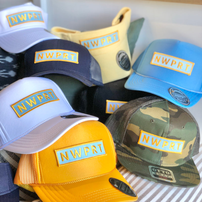 collection of NWPRT Supply Co. hat and visors.