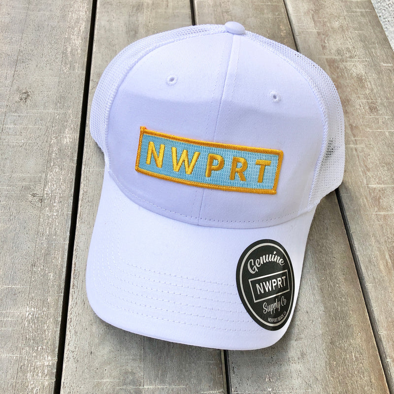 White canvas hat with mesh back by NWPRT with a NWPRT patch.