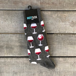 Dark grey men's socks with glasses of red wine.