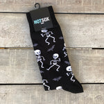Black men's socks with white dancing skeletons and grey bats.