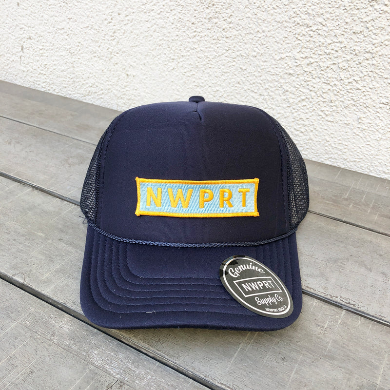 Navy blue foam trucker hat with mesh back by NWPRT with a NWPRT patch.