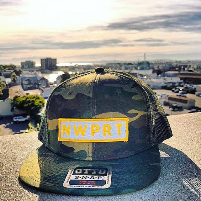 Camo canvas snapback mesh back and a NWPRT patch.