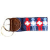 Needlepoint and leather keychain with red and blue healthcare icons.