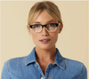 A woman modeling the Layover style reader glasses, by Peepers.