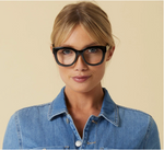 A woman modeling the Center stage focus readers, by Peepers, in black.