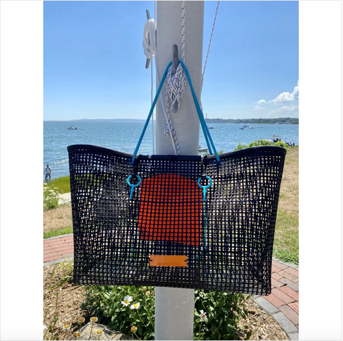 The Jumbo Oyster Bag is a large rigid black mesh bag with turquoise blue rope handles and blue hooks to secure closure. It has an orange internal drawstring pouch. The Jumbo sized Oyster bag is approximately 21X16x10 inches.