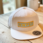 White 6-pannel canvas hat by NWPRT supply company, with their signature gold and grey NWPRT patch on the front.