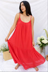 red supremely comfortable spaghetti strap dress with rounded neck that reaches ankles on model.