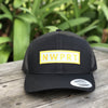 Black canvas hat with mesh back and a NWPRT patch.