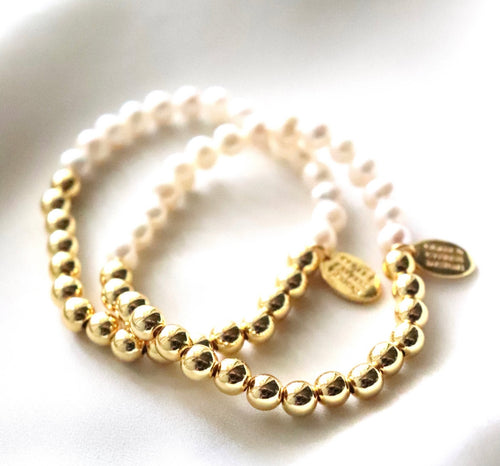 stretch bracelet with half golden beads and half pearl beads