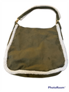 large green bag with fleece lined hand strap that. Decorated with white fleece at the seams
