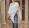 white linen poncho with fringed edges